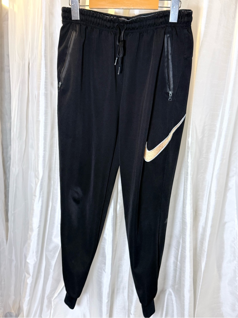 Nike Black Joggers with Gold Swoosh Accent